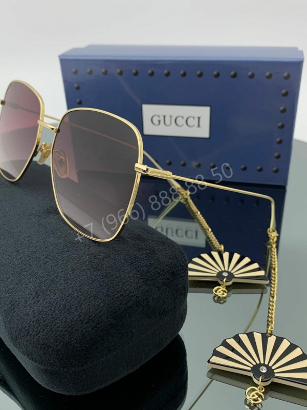 Солнцезащитные очки Gucci